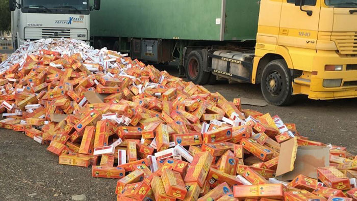Smugglers hide 10,200 cigarette packs, chewing tobacco in truck carrying sand