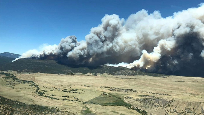 Crews gain ground on New Mexico wildfire as Colorado blaze rages