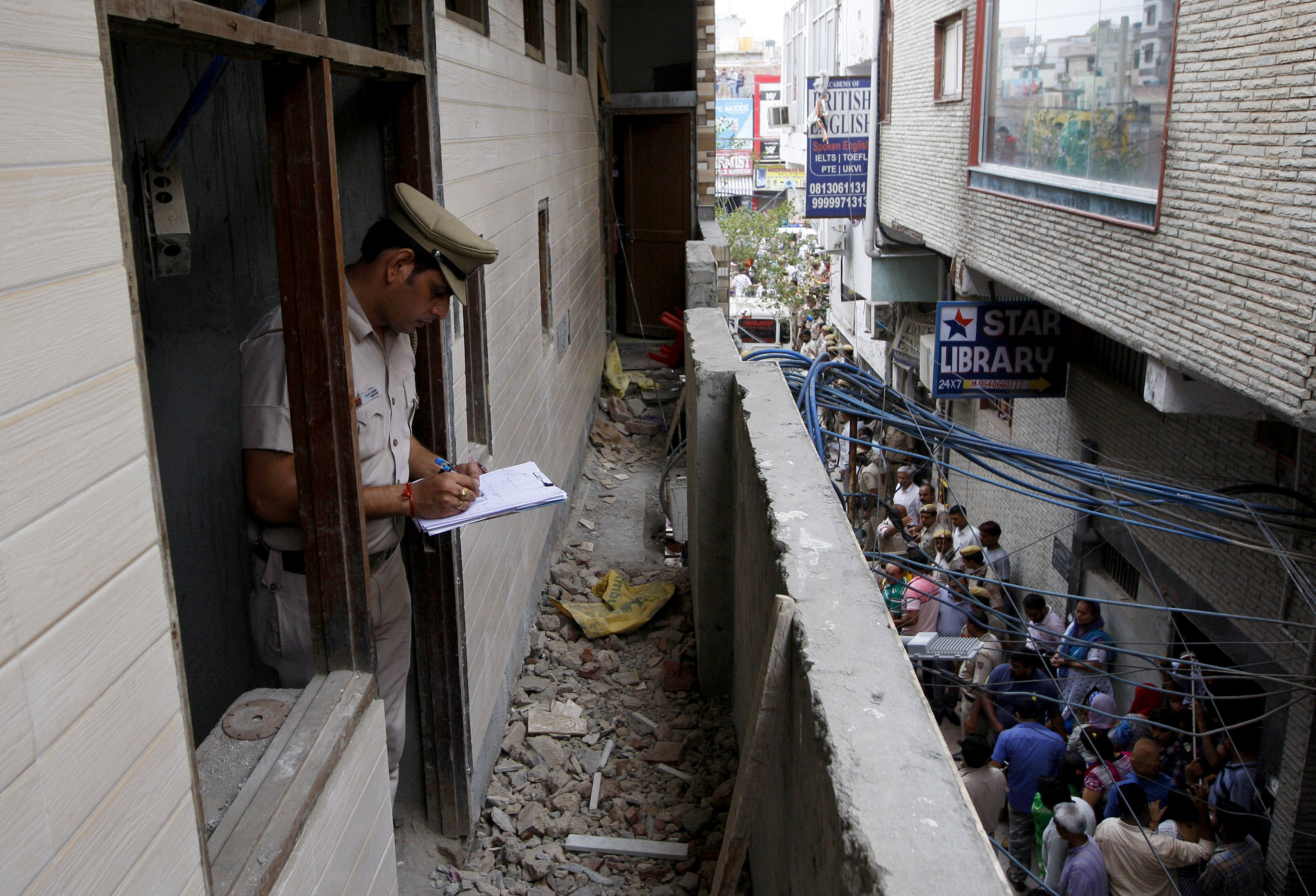 Eleven people killed in India's capital, police probe link to gang war