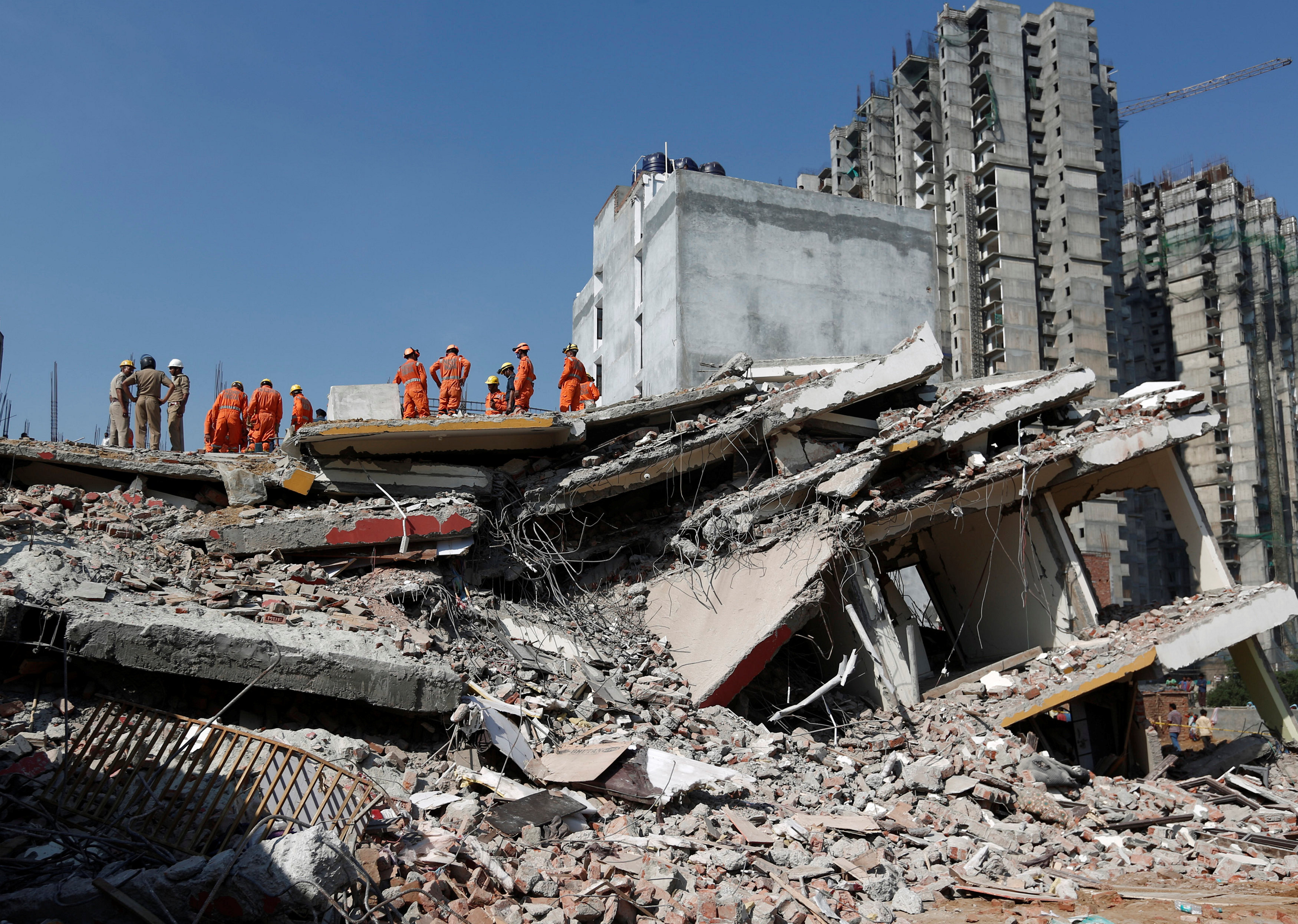 Building collapse in Delhi suburb kills at least 2, more feared dead
