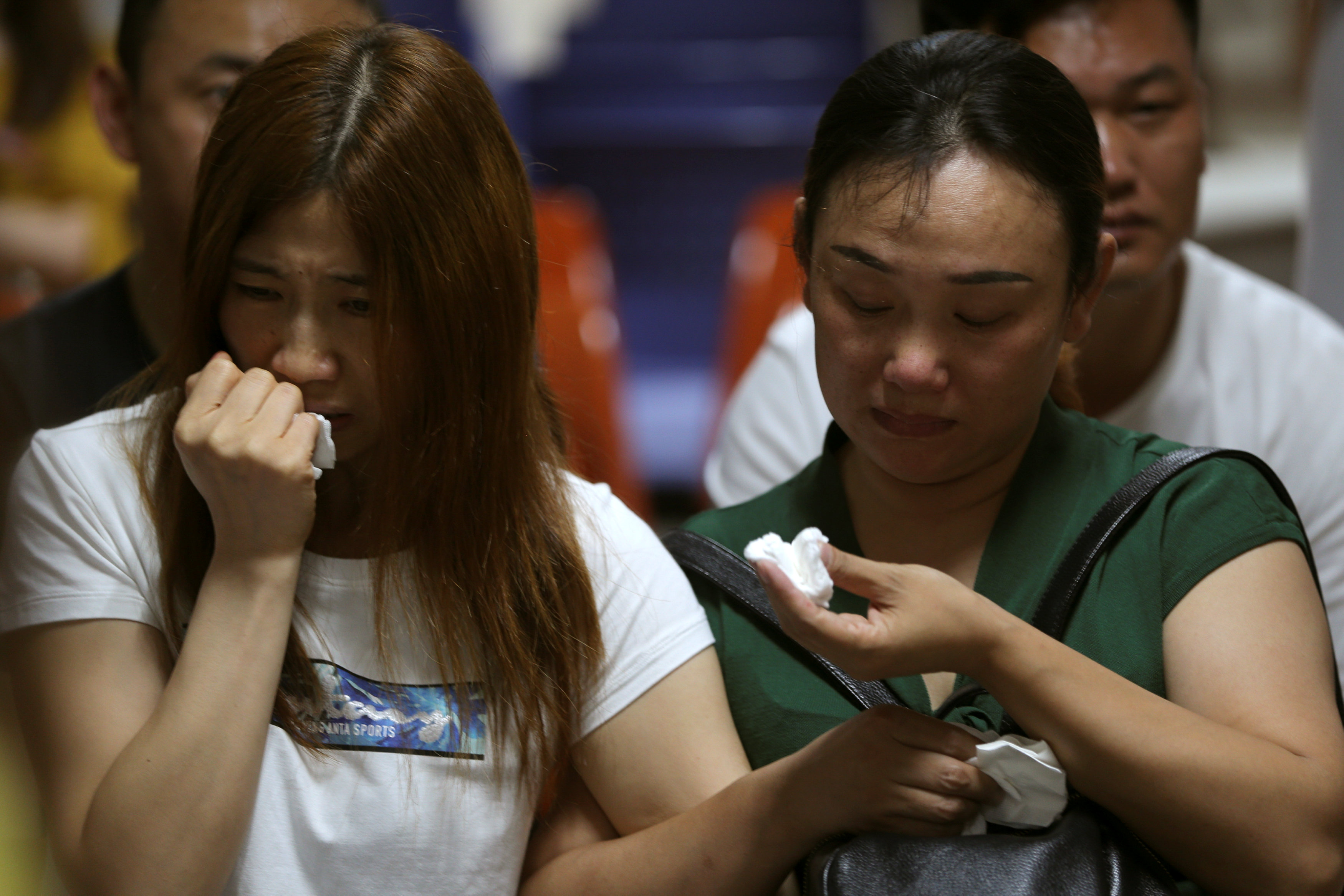 Chinese relatives wait for news after Thai tourist boat sinking