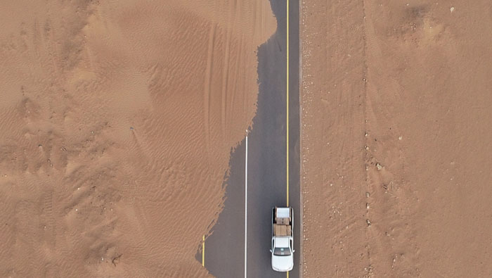 Round-the-clock toil to save this road in Oman from ever encroaching desert sand