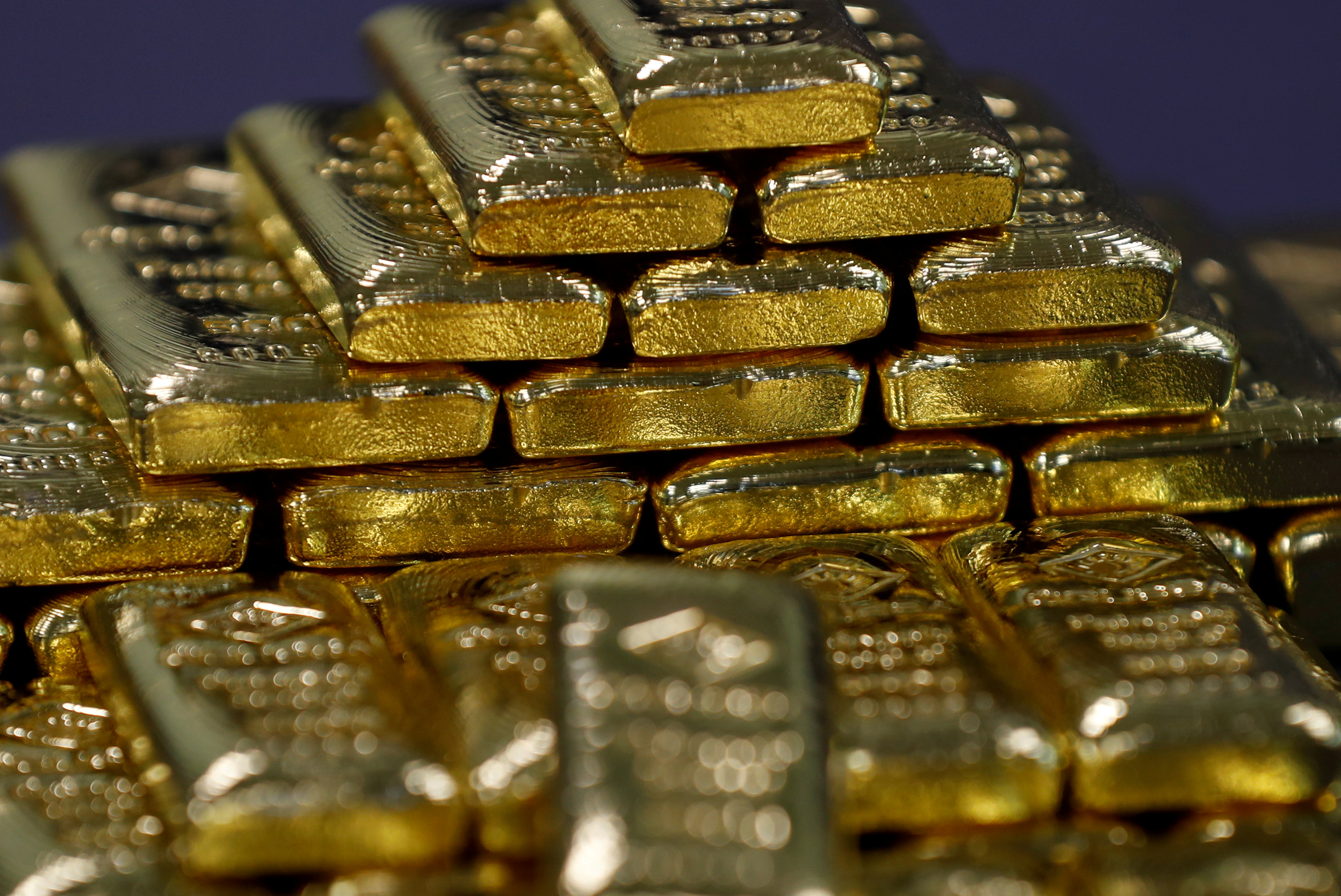 Gold hits 17-month low as investors seek refuge in dollar