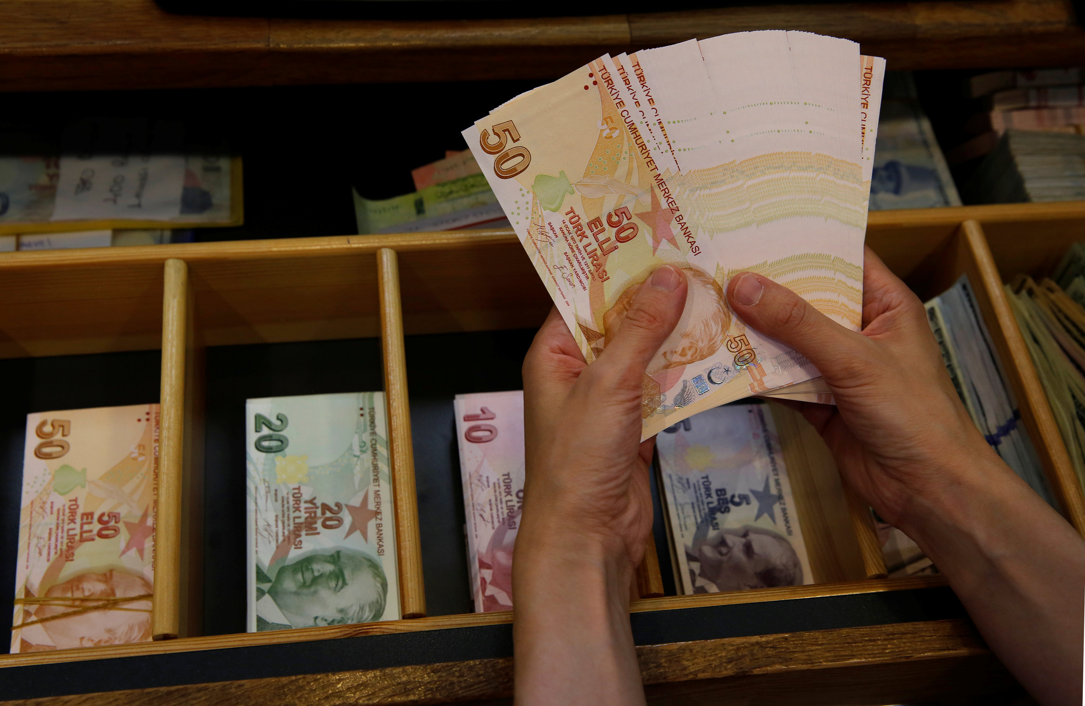 Turkish lira edges up from record low on central bank pledge, investor call
