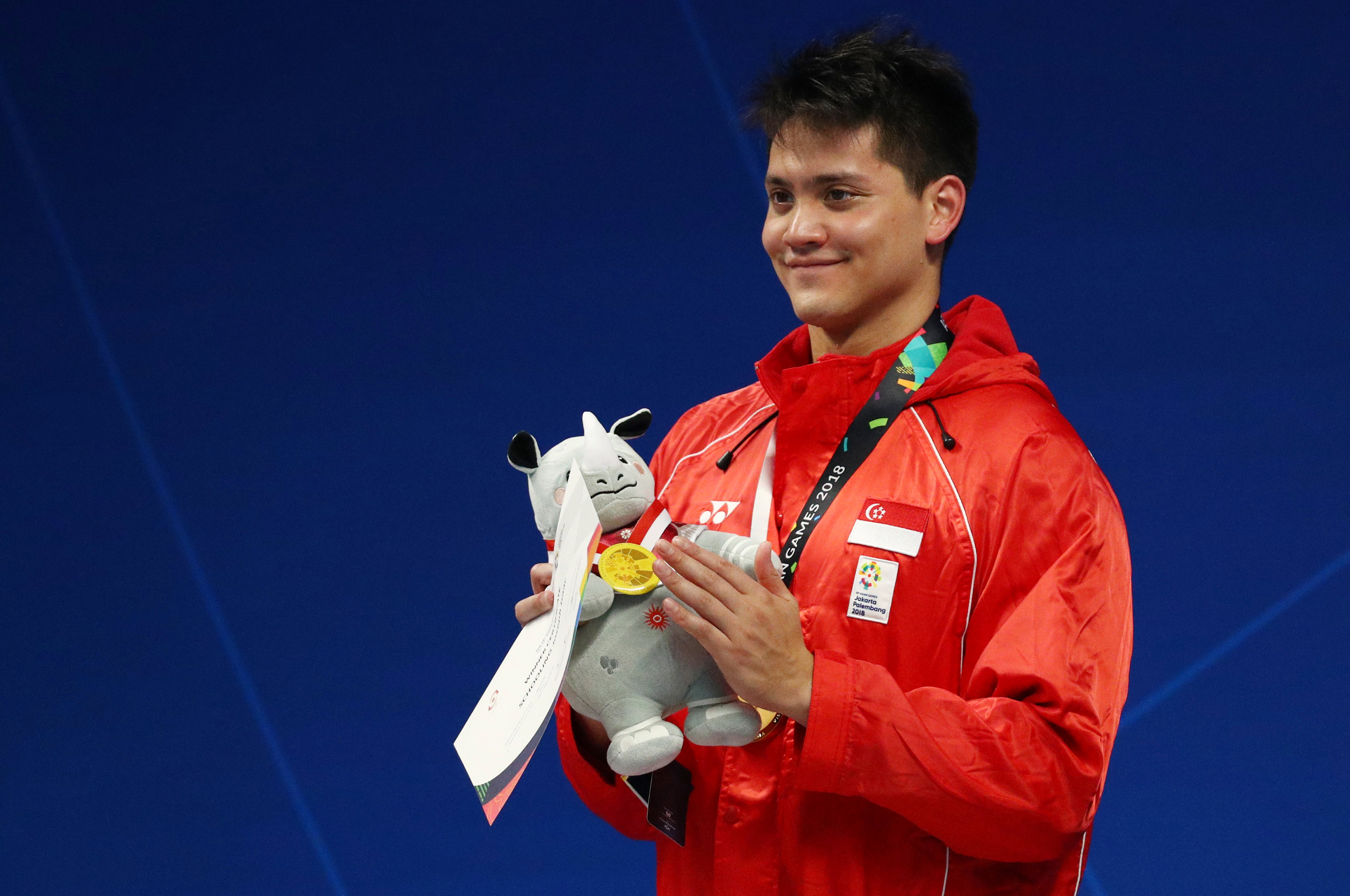 Swimming: Singapore's Schooling snaps China-Japan grip on Jakarta pool gold