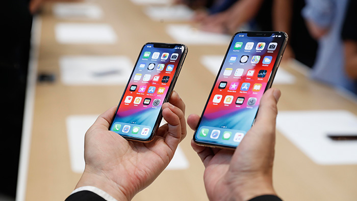 Apple iPhones get bigger and pricier, Watch turns to health