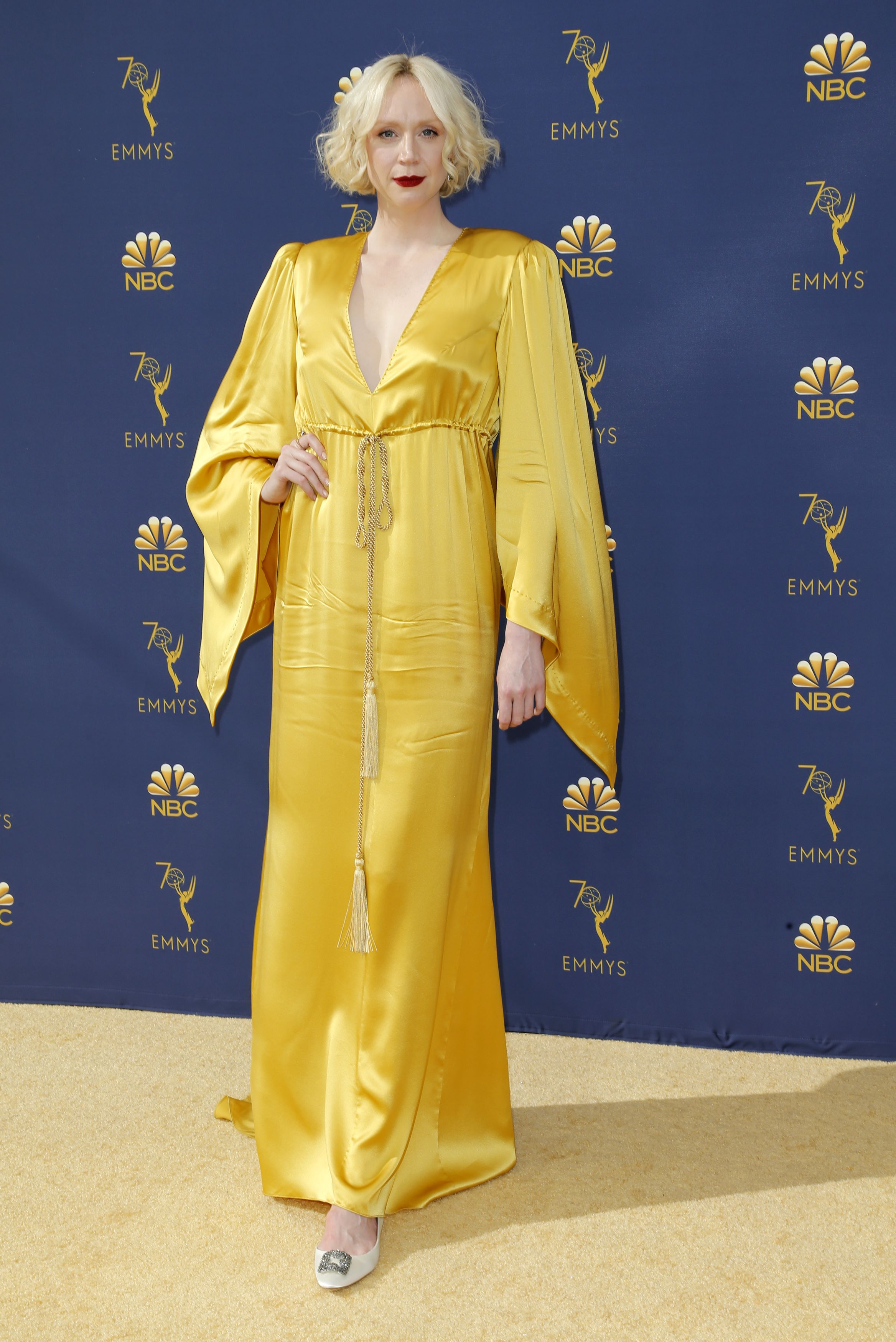 Sparkling whites, sunny yellows shine on gold carpet at TV's Emmy awards