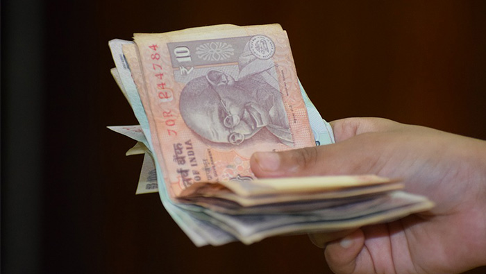 Indian rupee falls to new low against Omani rial