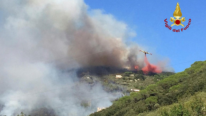 Hundreds evacuated, airport closed after forest fire in Italy