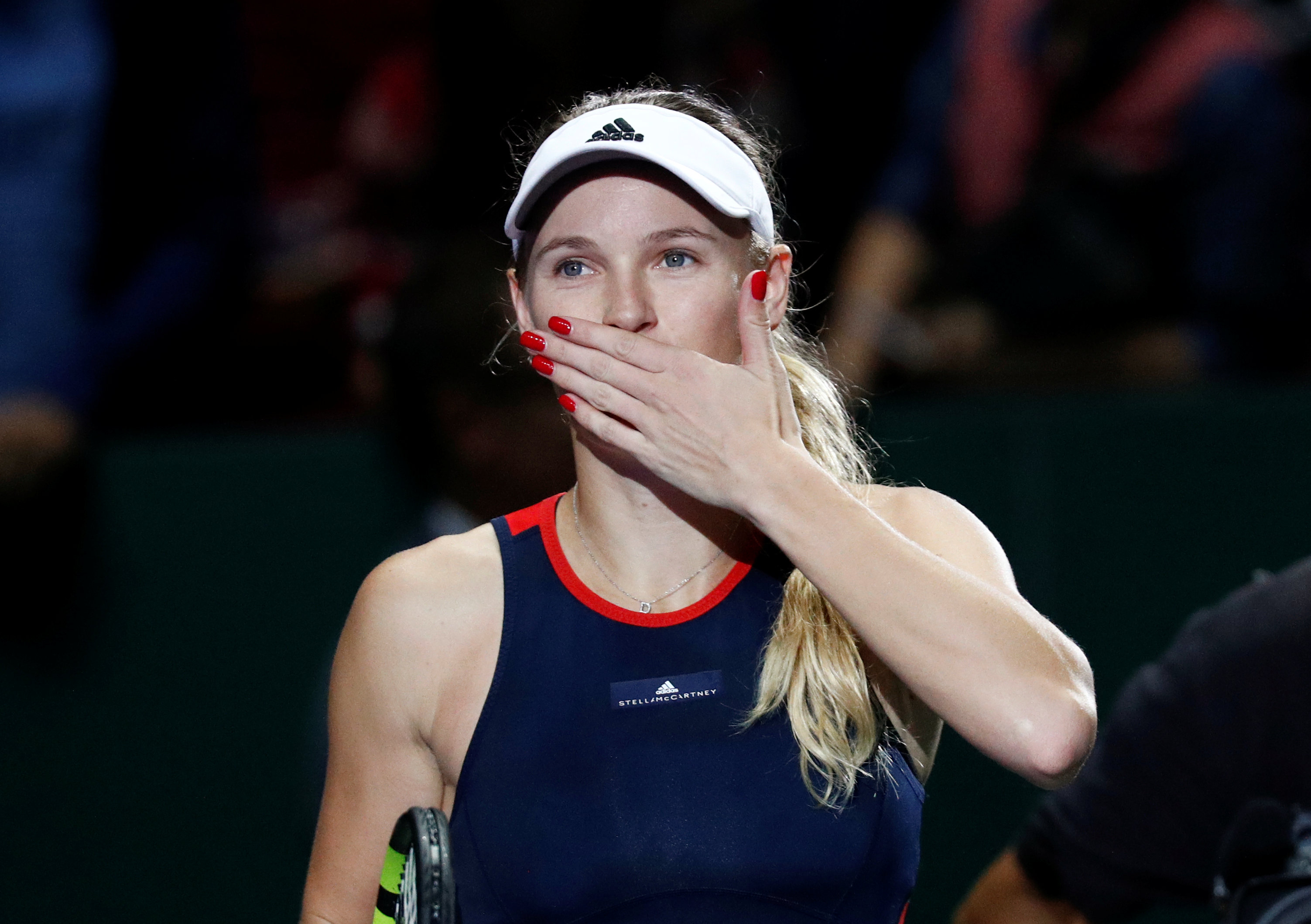 Tennis: Wozniacki stands firm to stay alive in Singapore