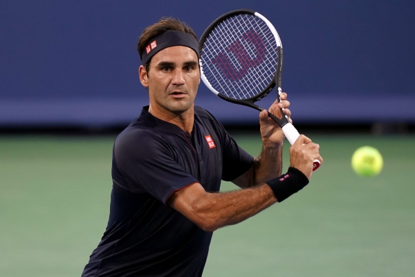 Tennis: Federer reaches semi-finals after being stretched by Simon