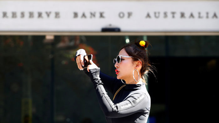 Australia central bank hold rates as home prices fall