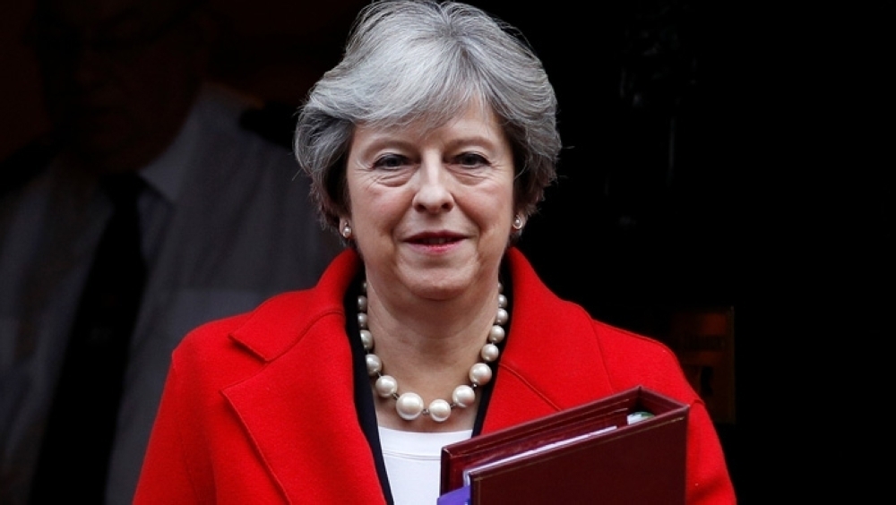 British PM says will return to EU to discuss Irish backstop