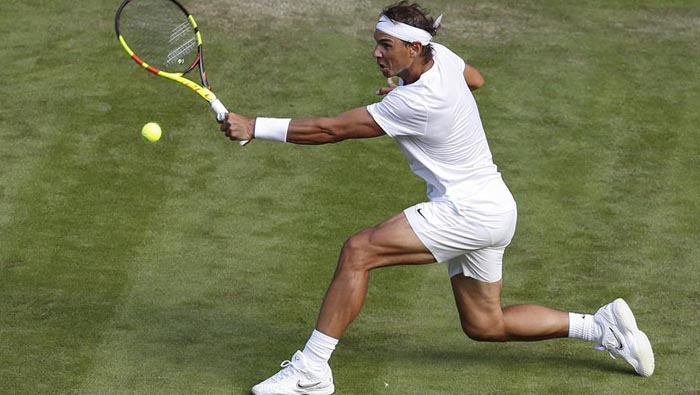 Injured Sharapova exists as Nadal, Federer advance