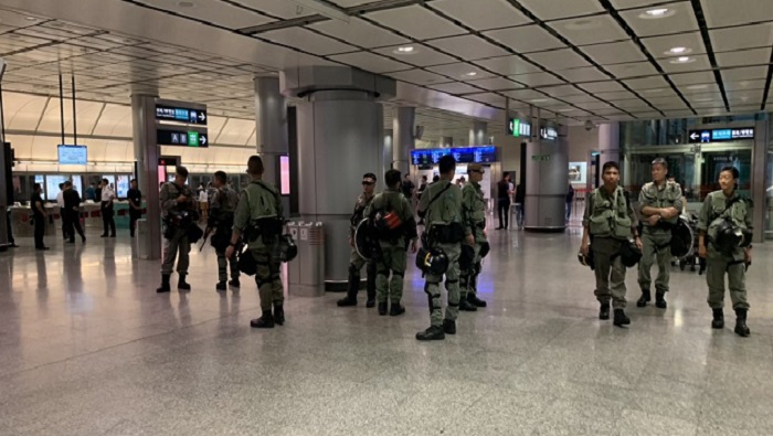 Security tight at Hong Kong airport after overnight violence on streets