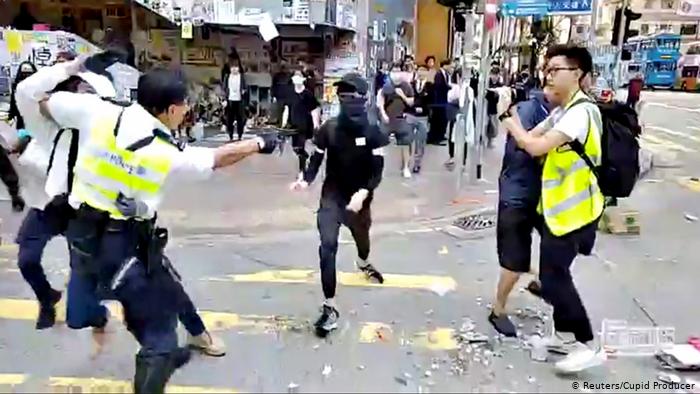 Hong Kong police shoot man during morning protests