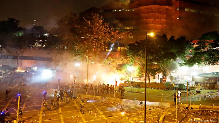 Hong Kong police threaten 'live bullets' during university siege