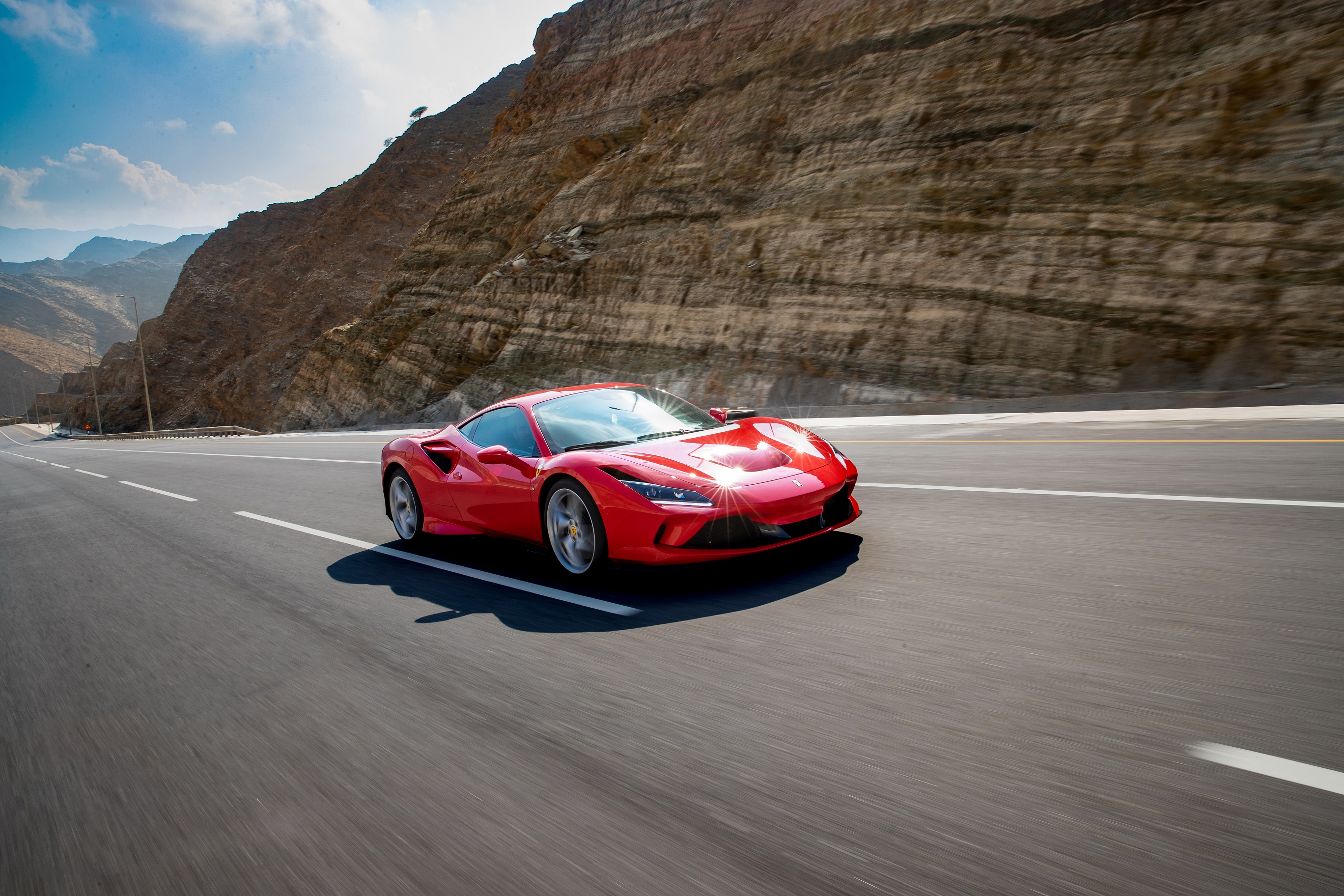 Ferrari enthusiasts enjoy the Ferrari F8 Tributo on the beautiful mountain roads of Oman