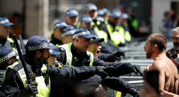 Over 100 arrested as UK far-right groups clash with police