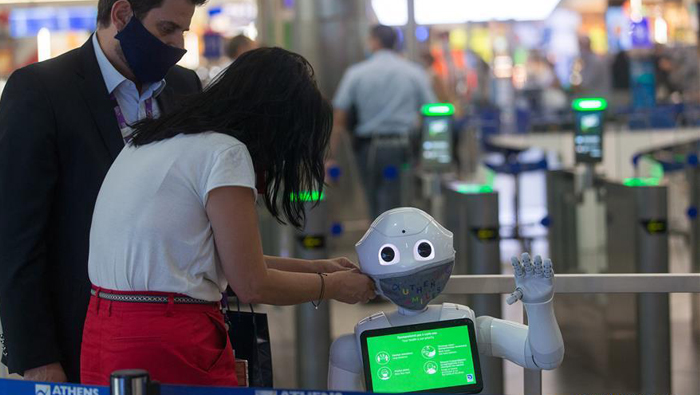 Robots inform travellers on COVID-19 measures