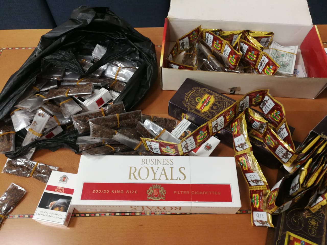 Expat workers arrested for selling tobacco