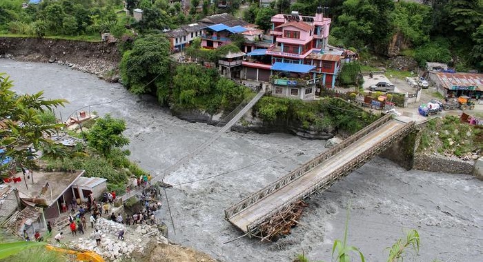 Floods and landslides lash Nepal, scores dead
