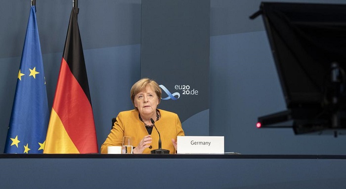 Angela Merkel calls for global action to beat coronavirus at G20
