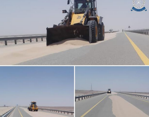 Sand dunes being cleared on this road in Oman