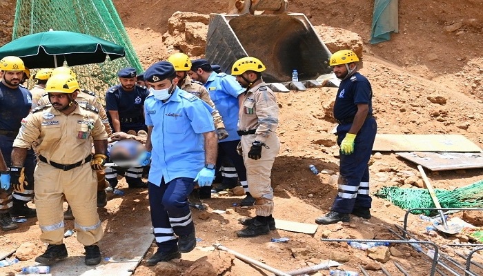 Soil collapses over workers in Oman