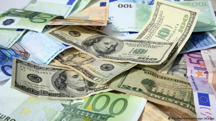 Euro falls to 20-year low against the dollar