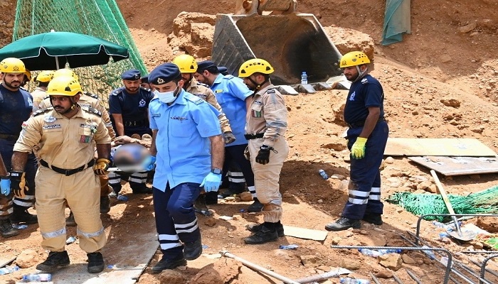 Two expats dead as soil caves in