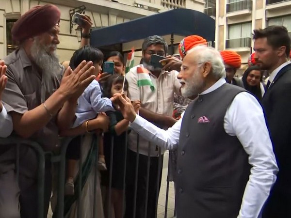 Selfies, slogans and songs: PM Modi receives a rousing welcome from Indian diaspora in Paris