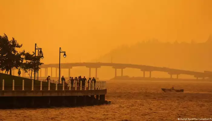 Tens of thousands flee western Canada wildfires