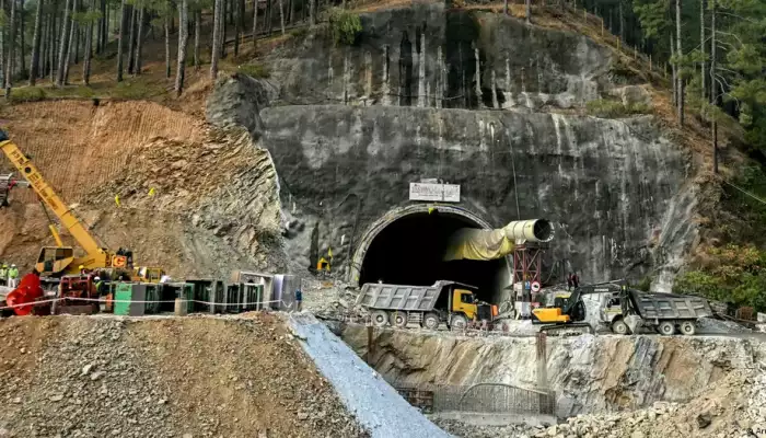 India: Rescuers dig by hand to reach workers in tunnel