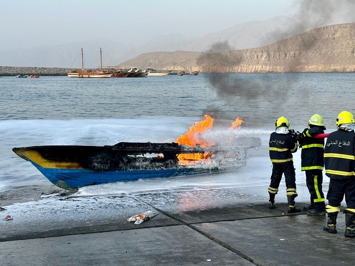 CDAA teams extinguish fire in a boat at Khasab port